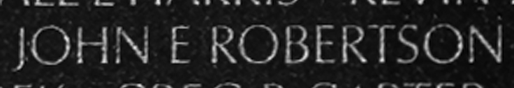 Corporal John Ernest Robertson's name inscribed on The Wall.